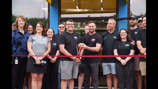 Slick City Grand Opening Includes Ribbon Cutting, $20K Donation to Nonprofit